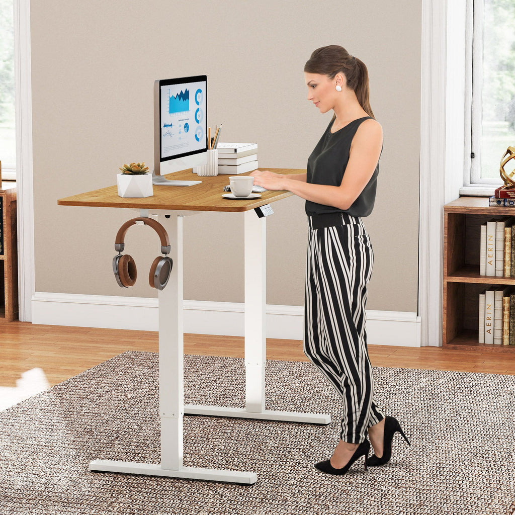 Electric standing desk frame by DirectDeals with height adjustment and LED display, shown with its sturdy metal base.